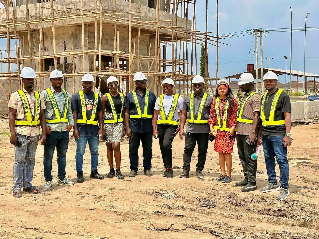 Construction team wearing safety helmets and reflective vests on site