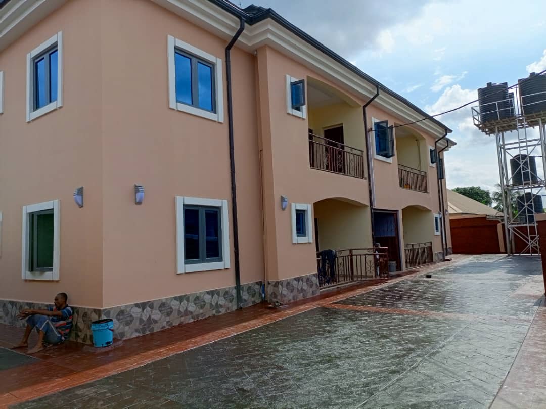 Building exterior with installed windows and paving